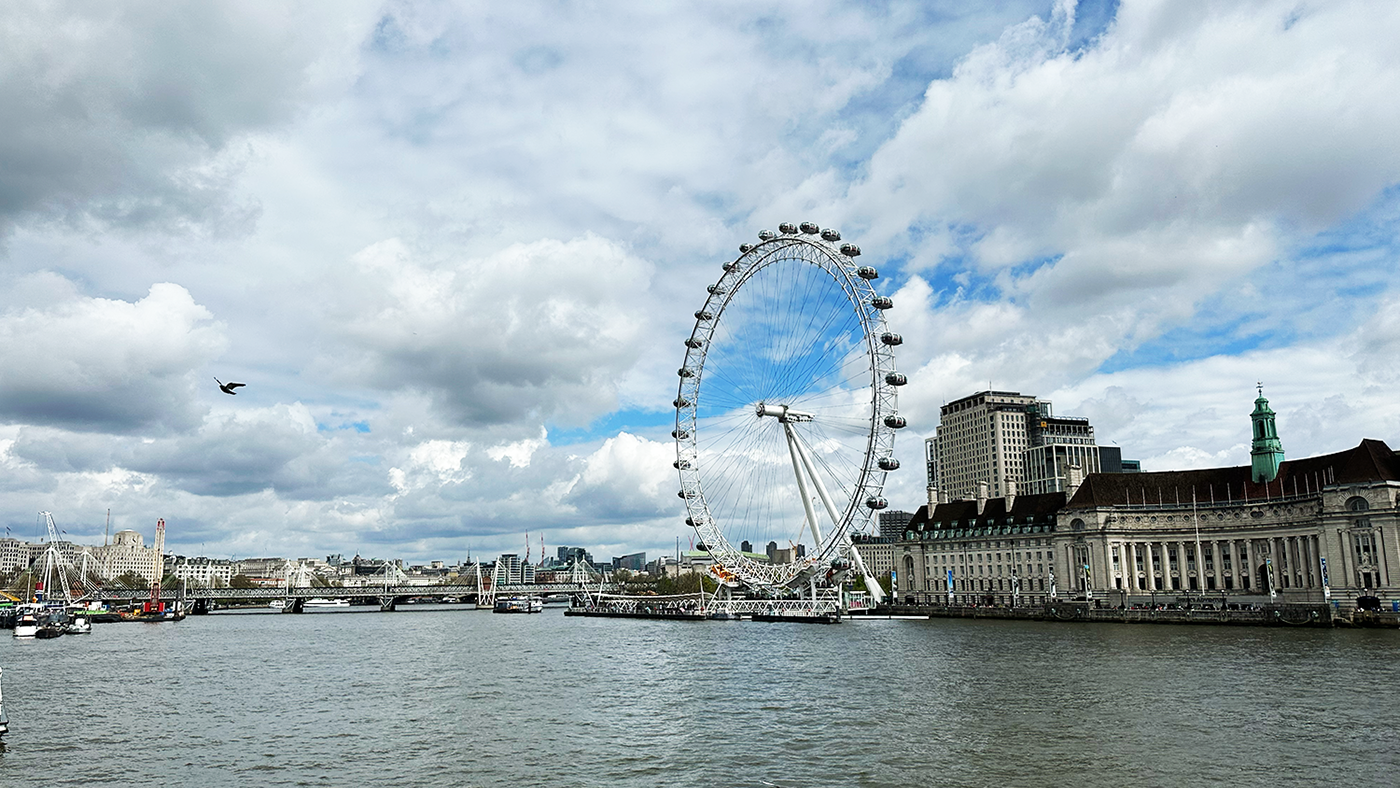 A photo of The London Eye sitting along the River Thames.